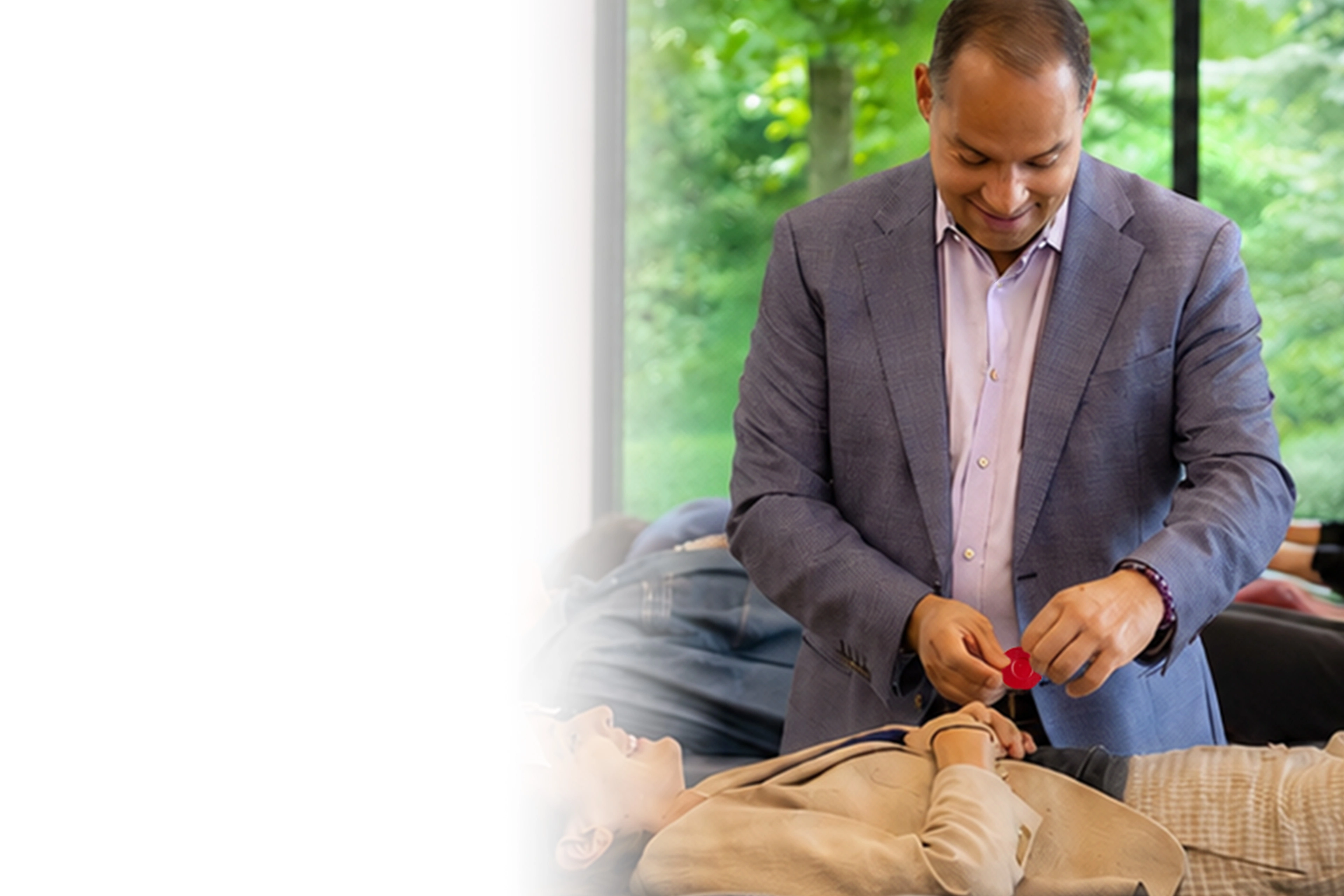 Dr. Garcia demonstrating biomagnetism techniques with a seminar participant